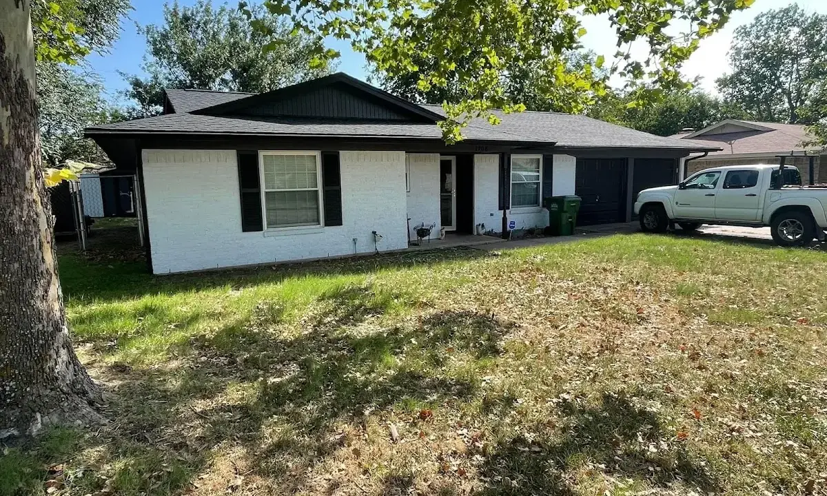 Professional roofing crew working on a residential roof in Byram